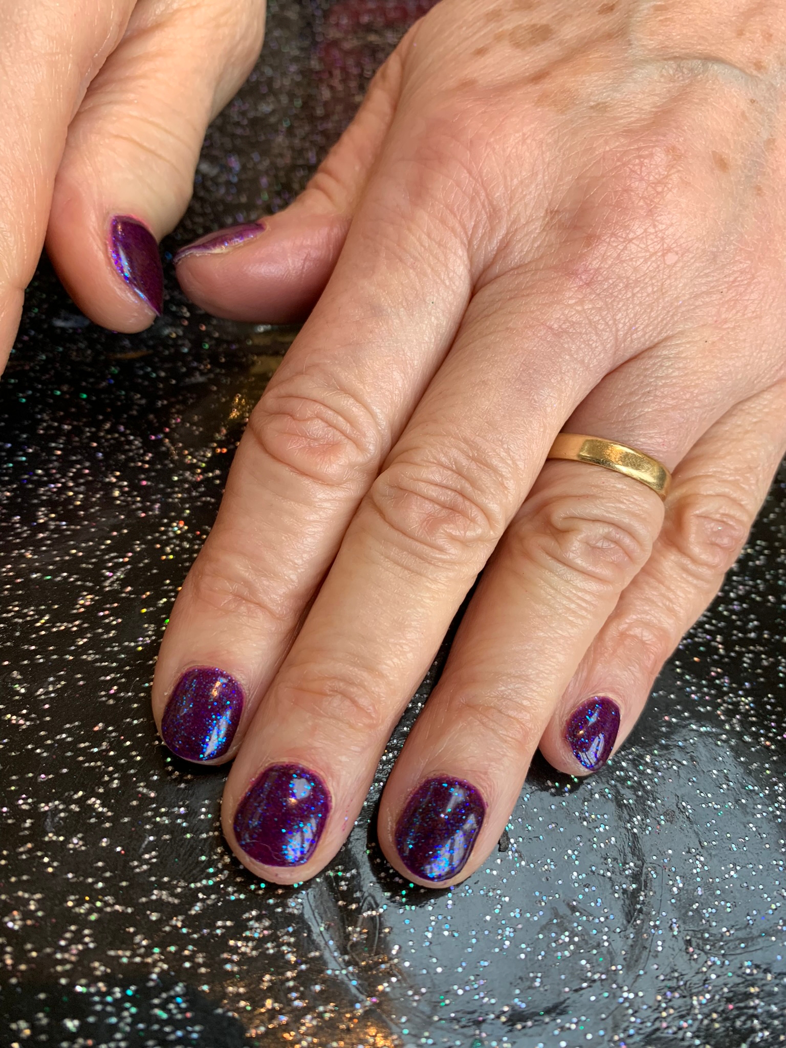 Happy 2023 New sparkly holographic purple, this goes super blingy when the light shines on it nails by natalie rose mobile manicure and pedicure london