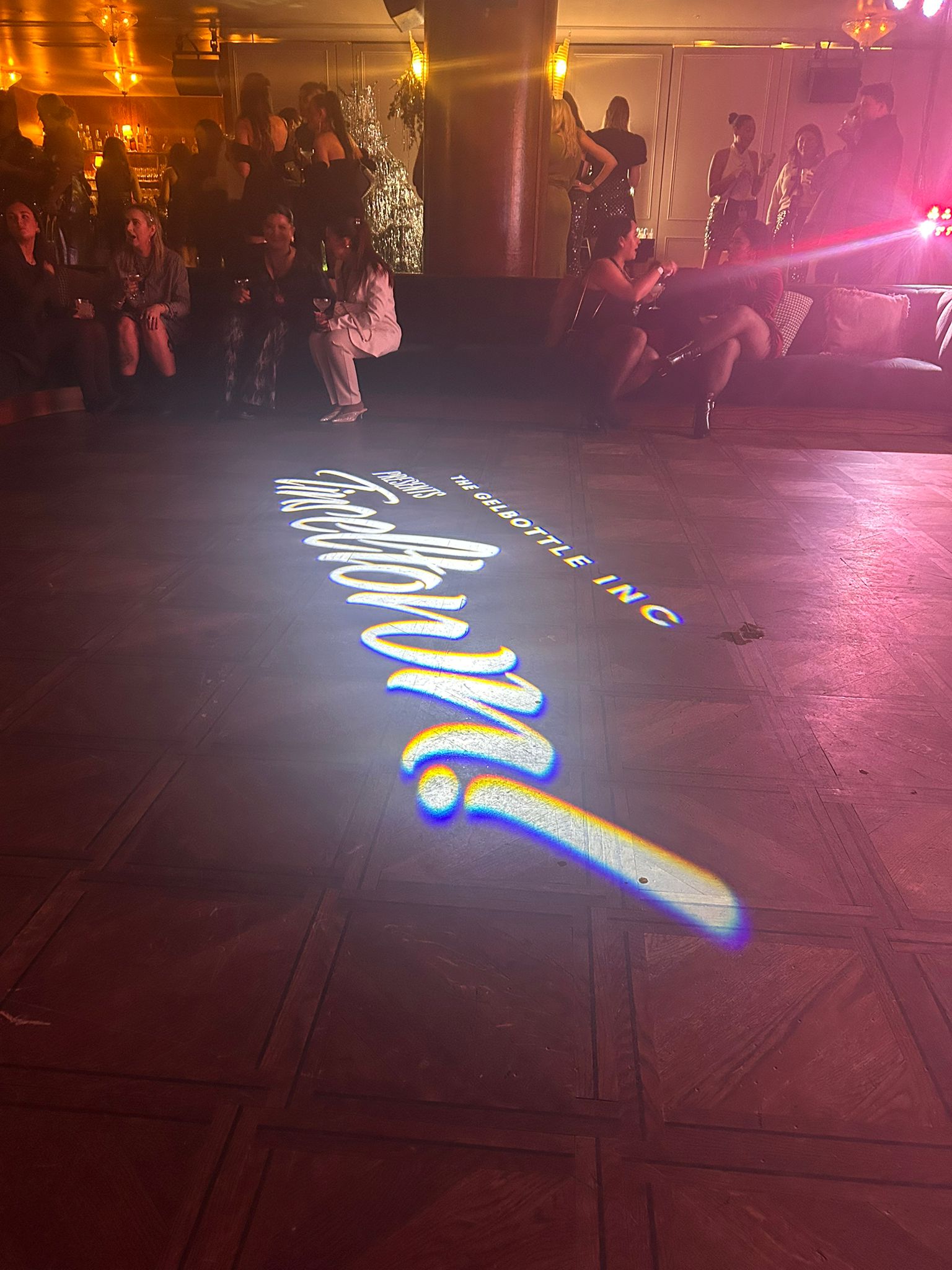 The GelBottle Tinseltown launch event at White City House with glam décor and guests enjoying drinks